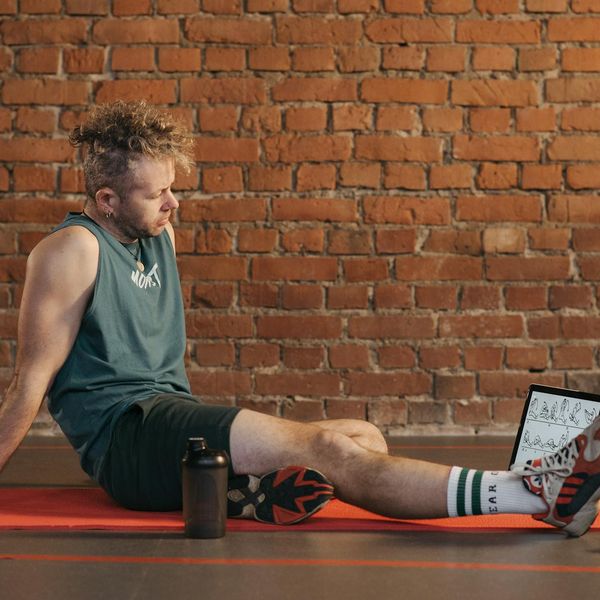 Focused man meditating after a workout session.